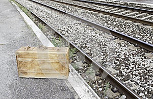 Old suitcase in a train station