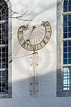 Old sun clock on the wall of church