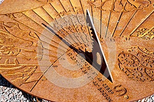 The old sundial shows almost noon on a Sunny day