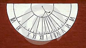 Old sundial on the wall