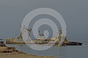 old Sunken ship on the sea coast