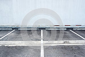 Old surface and white painted sign for parking slot line