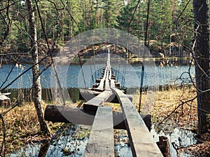 Old suspension bridge over the lake