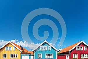 Old swedish houses in front of a blue sky photo