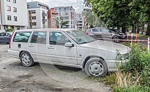 Old veteran classic abandoned scrap Swedish Volvo V70 private car hatchback parked right side view