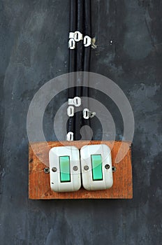 Old switch on the cement wall