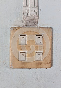Old switch on cement wall