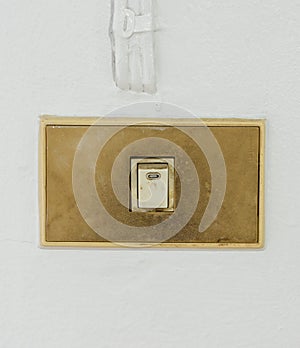 Old switch on white wall
