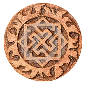 Old symbol on terracotta amulet photo
