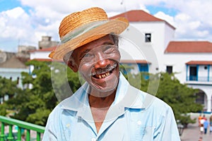 Old sympathetic cuban man with straw hat make a fu