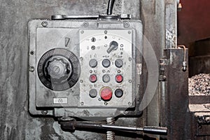 Old system with power and buttons control panel of industrial equipment in the factory
