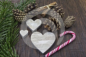 At an old table the Christmas decoration is placed ready