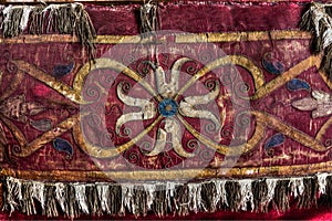 old table cloth with floral pattern in burgundy color in Lerma, Burgos, Spain