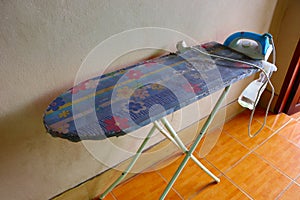 Old table, the iron, and spray water bottle - laundry concept