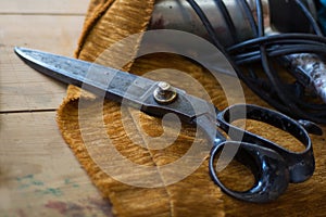 Old tailor scissors in a upholstery manufactory photo