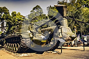 Old tank and Chinook helicopter on display in the War remnants museum in Saigon. Both fought in the Vietnam war. (Ho Chi Minh City