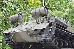 The old tank stands on a pedestal