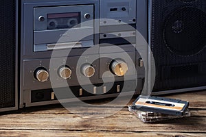 the old tape recorder and cassette on wooden table