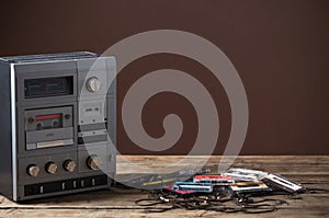 the old tape recorder and cassette on wooden table