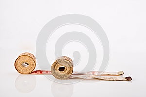 Old tapes measure on white background