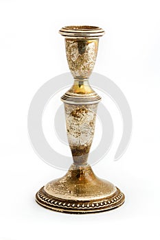 Old tarnished candlestick holder