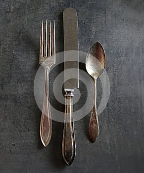 Old tarnished fork,knife and spoon