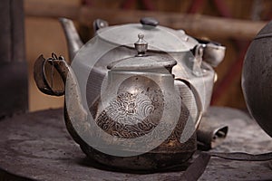 Old teapot and kettle in a kyrgyz yurt kitchen