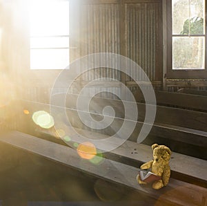 Old teddy bear in abandoned church