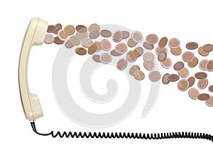 Old telephone headset with coins