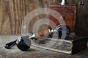 Old telephone and retro book on a wood