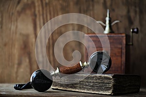 Old telephone and retro book on a wood