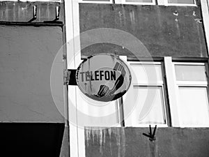 Old telephone street sign written in romanian or hungarian languages remained from the 1980`s