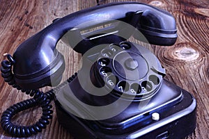 Old telephone on wood / vintage style