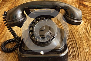 Old telephone on wood / vintage style