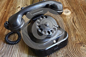 Old telephone on wood / vintage style