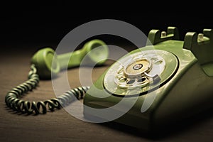 Old telephone on a wooden table