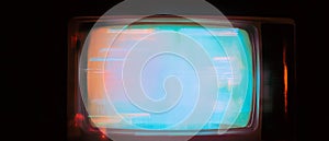 Old television screen overlay with ghosting effect and blurry image on dark background photo