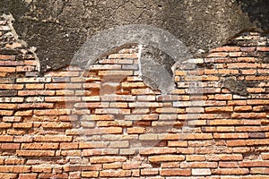 The old temple wall is made of orange bric