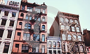 Old tenement houses with fire escapes, New York