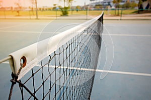 Old tennis net on court