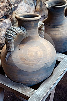 Old terracotta clay kitchenware jars and pots, ancient cookware