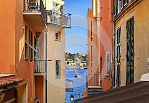 Old terracotta houses and the Mediterranean Sea in Villefranche sur Mer, France,