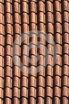 Old terracotta tile roof close up. background vertical