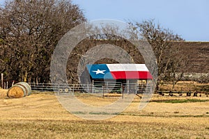 Old Texas barn with Texas flag painted on the roof