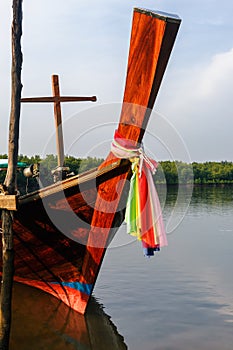 Old Thai fishing boat at the beach near mangroves.