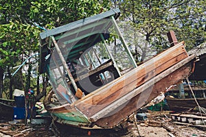 Old thai wooden boat on the beach