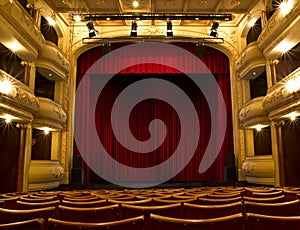 Old theater stage and red curtain photo