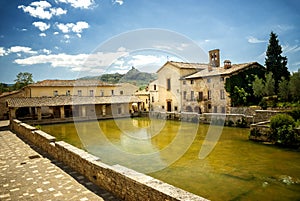 Old thermal baths in the medieval village Bagno Vignoni, Siena, Tuscany, Italy
