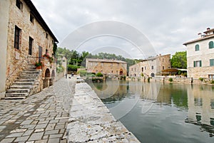 Old thermal baths in the medieval village Bagno Vignoni, Tuscany, Italy x