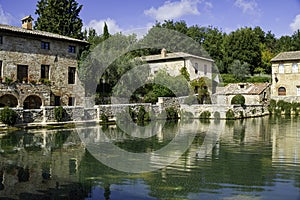 Old thermal baths in the medieval village Bagno Vignoni, Tuscany photo